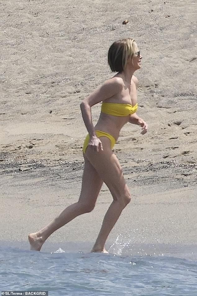 The star ran up the shore as she flashed her muscles in her legs