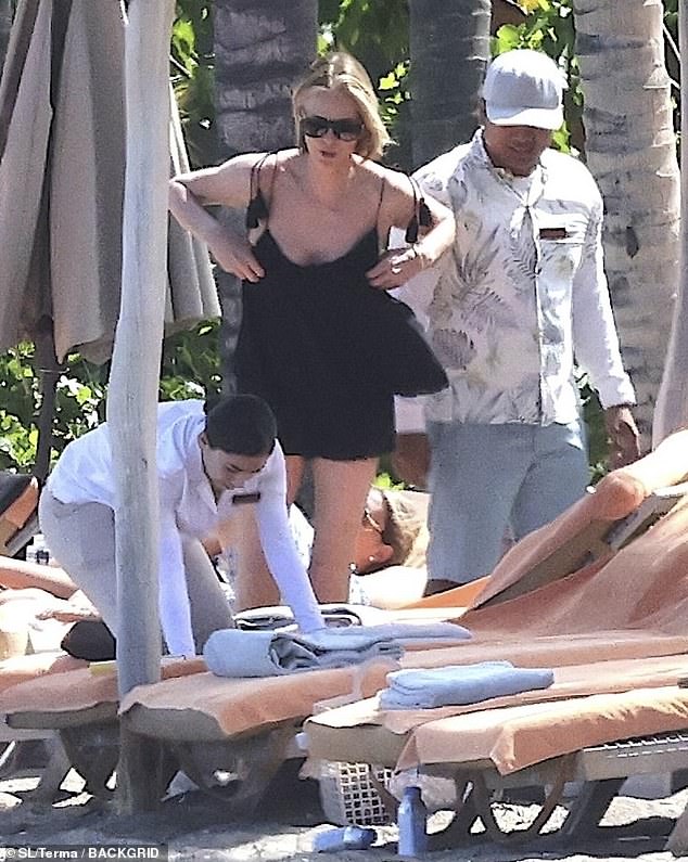 The silver screen star spoke with staff as they seemed to move her lounge chair