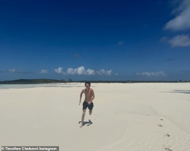 He went shirt-free with dark trunks as he ran on the shore