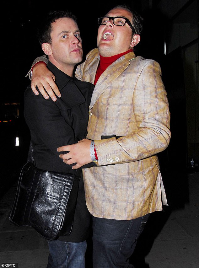 Mills pictured enjoying a boozy night out with Alan Carr in 2009. The BBC Radio 2 DJ has worked at the corporation for more than two decades
