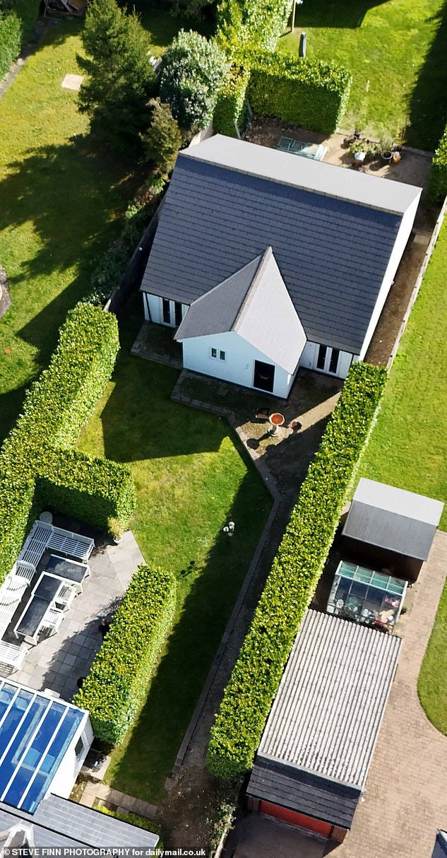 The annexe was built somewhere in the middle of the long garden following fire safety advice