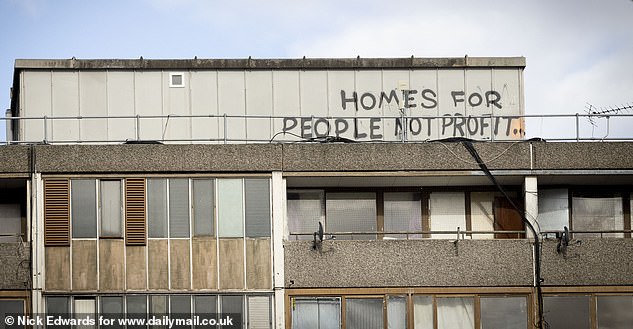 Graffiti sprayed on top of one of the Wendover blocks calls for the authorities to prioritise people over profits