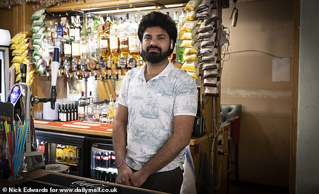 Pranith Raddy, 25, works behind the bar at the Hour Glass Hotel in the centre of the estate, and says they have fewer customers since residents have been moved out en masse
