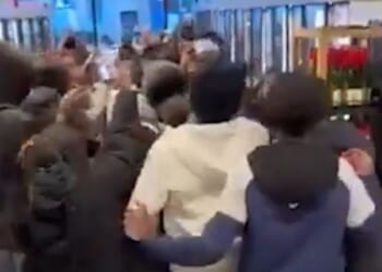 Shocking moment hooded mob of youngsters storm through M&S sparking huge brawl as police forced to break up chaos