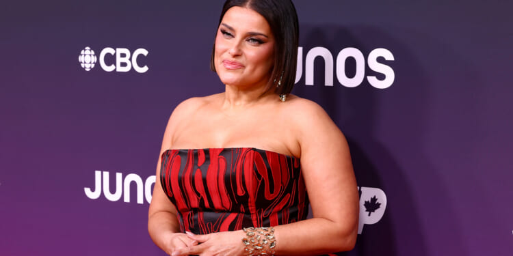 Nelly Furtado silences body shamers in curve-hugging strapless red gown as she's honored with Hall of Fame award