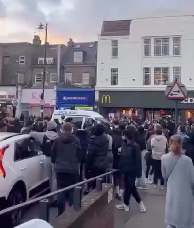 Police vehicles could be seen desperately trying to move through the throng of rioters who took to the streets in broad daylight on Tuesday afternoon