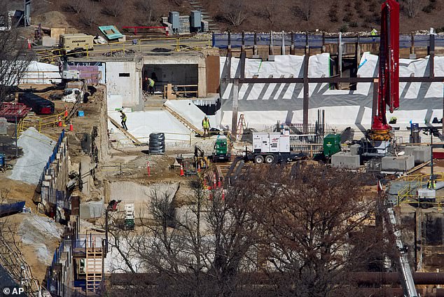 Workers can be seen working on the site of the former White House East Wing, which was torn down in October to make way for President Donald Trump's $400 million ballroom