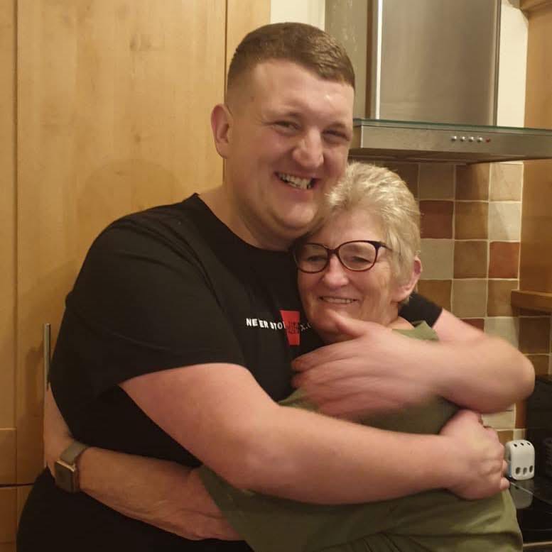 Paul Jones embracing his mother.