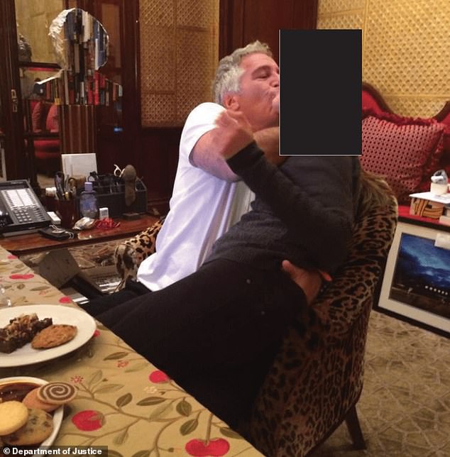 This undated photo released by the U.S. Department of Justice shows Jeffrey Epstein appearing to try and kiss a girl