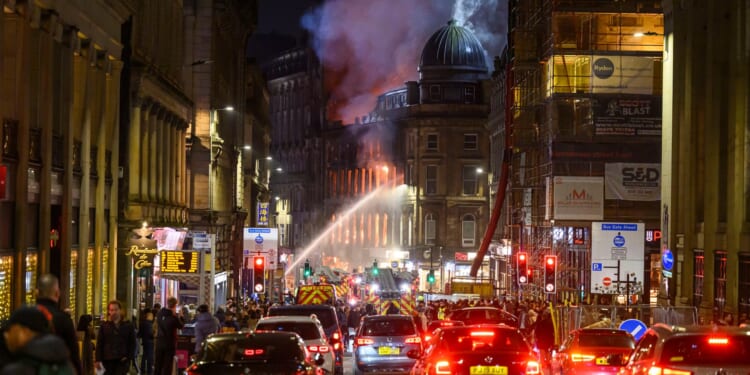 60 firefighters battle devastating Glasgow blaze as buildings collapse and historic station at risk