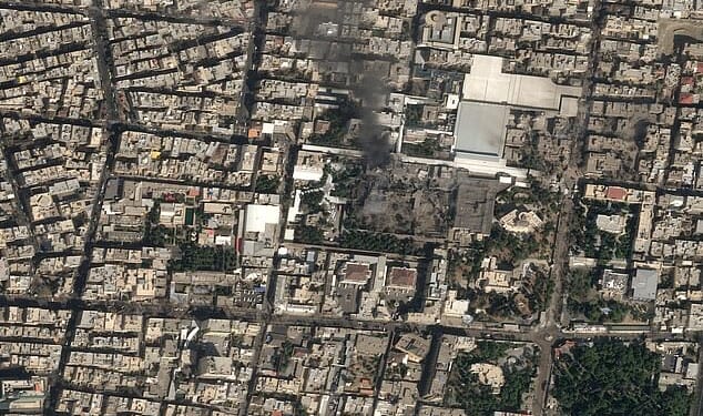 Saturday morning, Pasteur Street, central Tehran. Inside a vast walled compound sits the armoured and labyrinthine residence of Iran's Supreme Leader Ayatollah Khamenei. Pictured: A satellite image shows smoke rising and heavy damage at the compound after the US-Israeli strike on Saturday