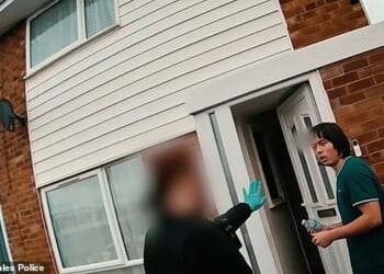 Tristan Roberts, 18, (pictured being arrested at his home after his mother's body was found on October 24) was jailed for life yesterday for bludgeoning his mother Angela Shellis to death with a hammer
