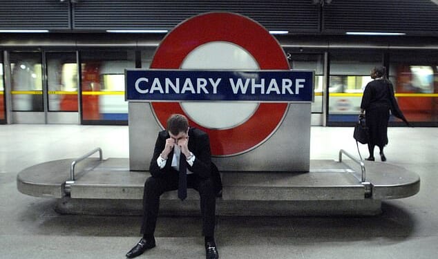 A banker at Canary Wharf station on September 12, 2008 amid the great financial crisis