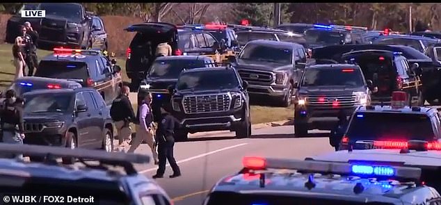 Dozens of police cars are seen here on the scene