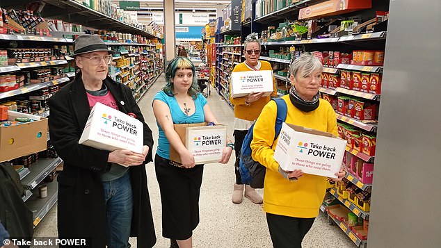 Activists took items from the shelves and put them in boxes labelled 'Take Back Power'