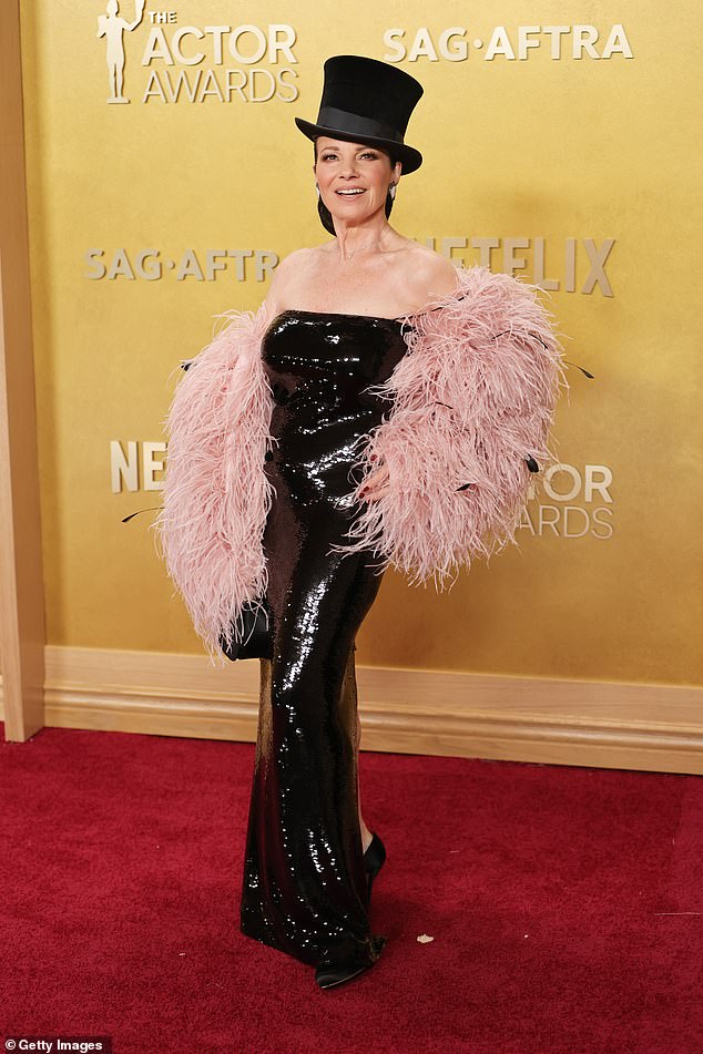 Stealing the show! Actress Fran Drescher wore a showgirl-esque outfit to the awards, donning a strapless, black sequin gown that had sleeves made of pink feathers. She tied it all together with a huge top hat and black silk heels