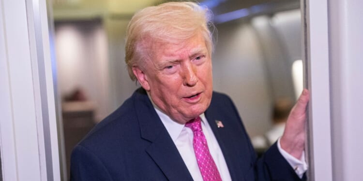 President Donald Trump speaks with reporters onboard Air Force One on March 29, 2026 while heading for Joint Base Andrews, Maryland, from West Palm Beach Florida.