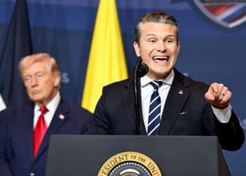 Defense Secretary Pete Hegseth addresses the audience as President Donald Trump listens during the Shield of the Americas Summit, a gathering with heads of state and government officials from 12 countries in the Americas at the Trump National Doral Golf Club on March 7, 2026, in Doral, Florida.