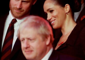 Former PM and Daily Mail columnist Boris Johnson sits in front of Prince Harry, Duke of Sussex, and Meghan, Duchess of Sussex at a remembrance service in 2019