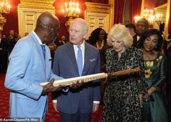 King Charles and Queen Camilla receive a cricket bat from West Indies great Sir Viv Richards during the annual Commonwealth Day Reception at St James's Palace in London