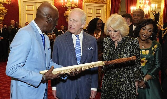 King Charles and Queen Camilla receive a cricket bat from West Indies great Sir Viv Richards during the annual Commonwealth Day Reception at St James's Palace in London