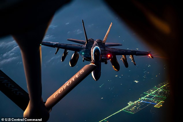 Pictured: A US Air Force KC-135 Stratotanker refuelling a Navy Super Hornet during Operation Epic Fury earlier on Thursday