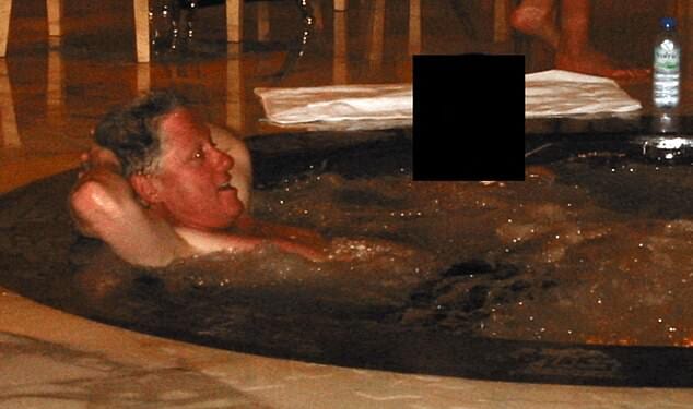 A photograph released in December by the Department of Justice shows Bill Clinton reclining in a hot tub beside a woman whose face was redacted