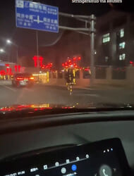 Bizarre moment robot seen jogging in the road at night in China