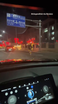 Bizarre moment robot seen jogging in the road at night in China