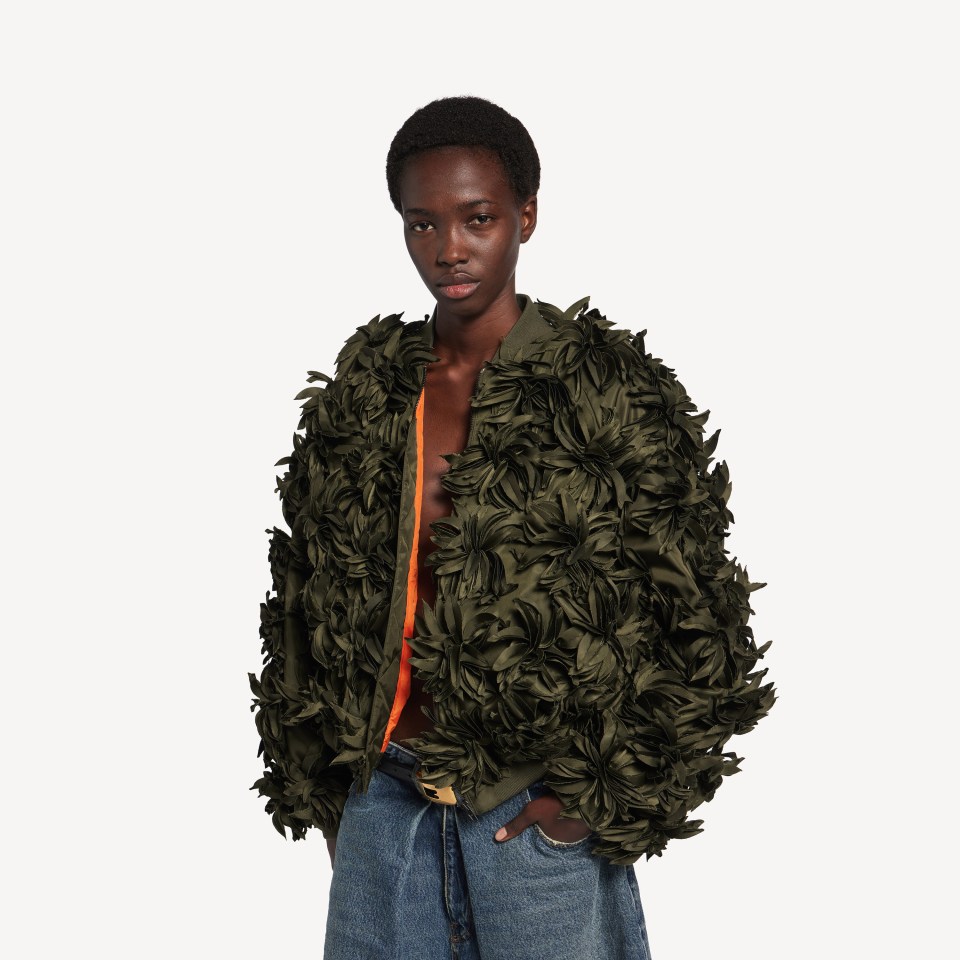 Model wearing Balenciaga's new Flowers Cocoon Bomber Jacket with fake leaves.