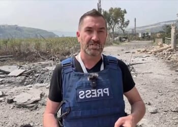 British journalist Steve Sweeney is seen moments before a missile struck the ground just feet behind him in southern Lebanon