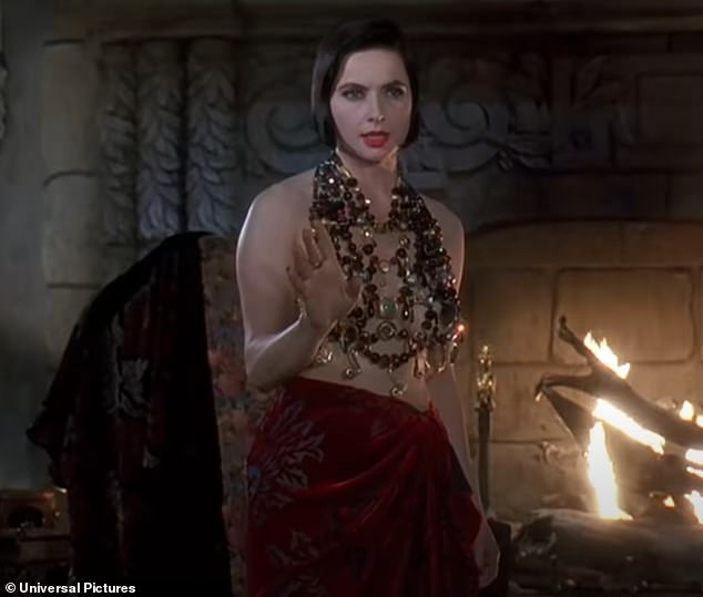 The actress could be seen wearing a bejeweled top piece and low-waisted skirt - a look that channeled Rossellini's iconic outfit from the 1992 film Death Becomes Her (seen above)