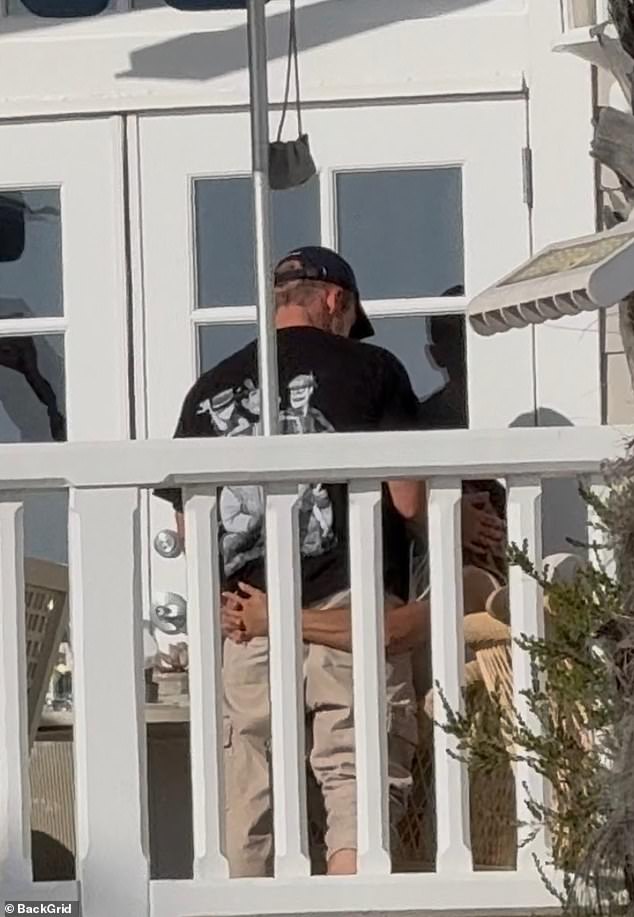 Sparks were flying as the couple continued their hangout session on a balcony