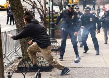 A left-wing activist flees after allegedly throwing a homemade explosive device toward police Saturday in front of Gracie Mansion, New York mayor Zohran Mamdani's official residence.