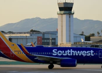 A Southwest Airlines plane taxis near the air traffic control tower at Hollywood Burbank Airport on Jan. 29, 2026, in Burbank, California.