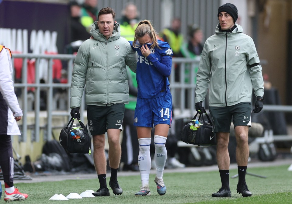 Chelsea's Nathalie Bjorn is assisted by medical staff as she is substituted off after sustaining an injury during the Women's League Cup Final against Manchester United.