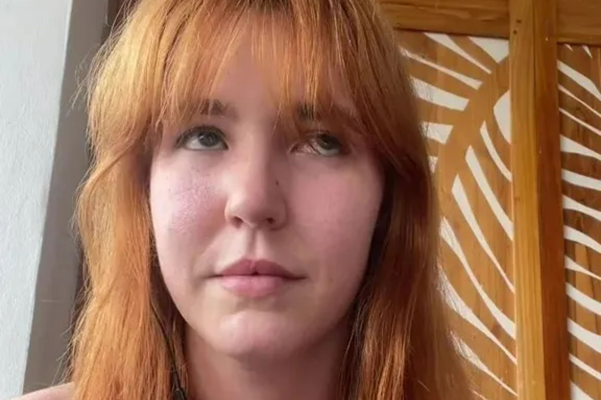 An image collage containing 1 images, Image 1 shows A red-haired woman wearing earphones and a strapless top looks upward with the text "1 min later" above her