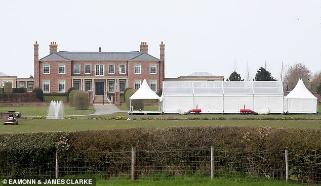 The couple have installed a giant marquee in their front garden, kitted out with outdoor heaters for the Easter weekend bash