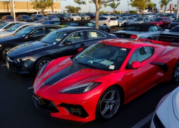 Vehicles for sale are parked in a lot at a CarMax dealership on April 24, 2025, in San Diego, California.
