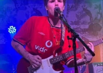 Cruz Beckham rocked a Manchester United football shirt in honour of his father David, who turned up to support him as he took his tour to the city on Wednesday