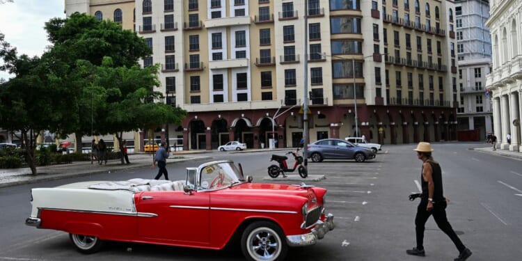A classic American car is seen parked near the Iberostar Parque Central hotel in Havana on March 12, 2026.