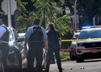 Police investigate the scene of a drive-by shooting on July 6, 2024, in Chicago, Illinois.