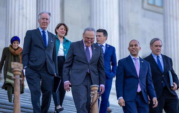 U.S. Senate Minority Leader Chuck Schumer (D-NY) and House Minority Leader Hakeem Jeffries (D-NY) walk out of the Capitol building to speak to the media on April 1, 2025