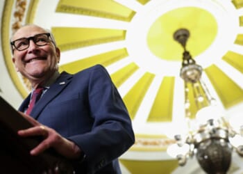 Sen. Minority Leader Chuck Schumer (D-NY) smiles at podium as he speaks to the press on Jan. 13, 2026.