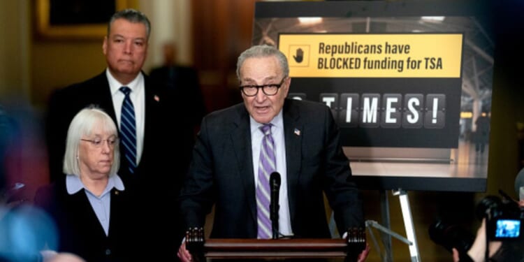 Senator Chuck Schumer and accompanying Senate Democrats speak to the press on March 24, 2026.