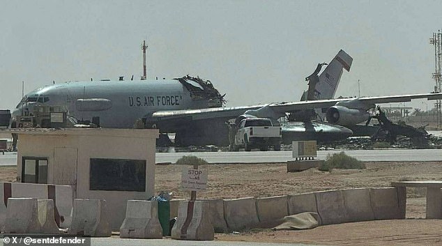 The shattered tail and debris-strewn wreckage of an E-3G surveillance plane appear to lie scattered across the runway following the Iranian attack on the Saudi base
