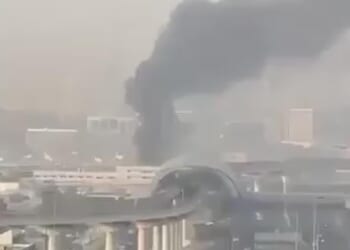 Smoke rises from Dubai International Airport this morning