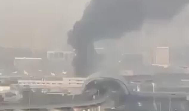 Smoke rises from Dubai International Airport this morning