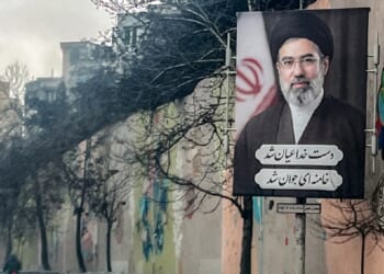 A banner depicting Iran's new Supreme Leader Ayatollah Mojtaba Khamenei is displayed on the side of a highway in Tehran on March 10.