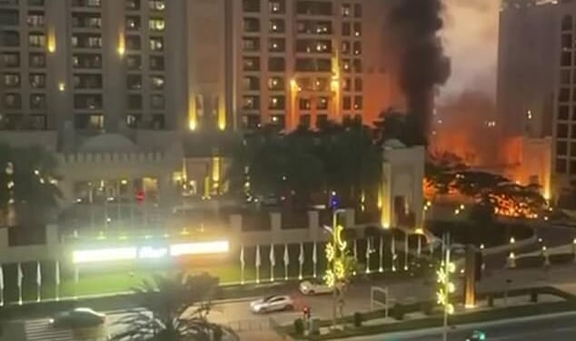 As many as 70 Britons have been locked up in the United Arab Emirates for taking photos and videos of drone and missile attacks, The Mail on Sunday can reveal. Pictured: The Palm Jumeirah Fairmont hotel after it was hit by a Shahed suicide drone on February 28, 2026